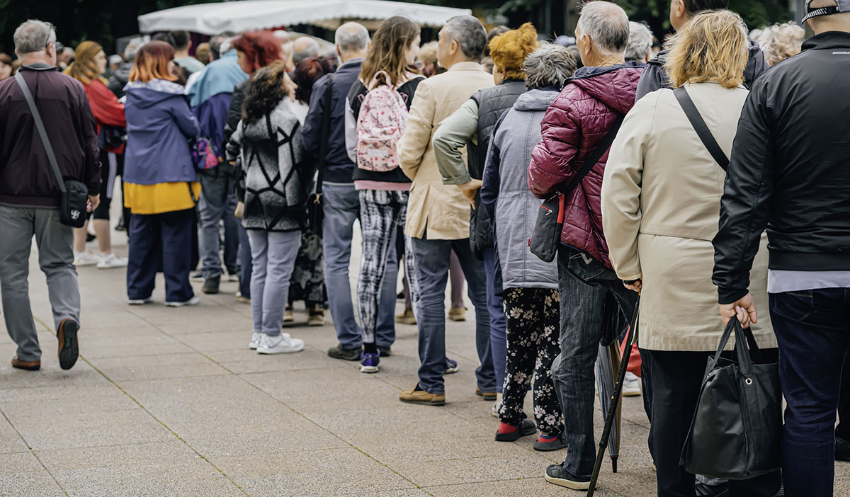 People waiting in long entry queue